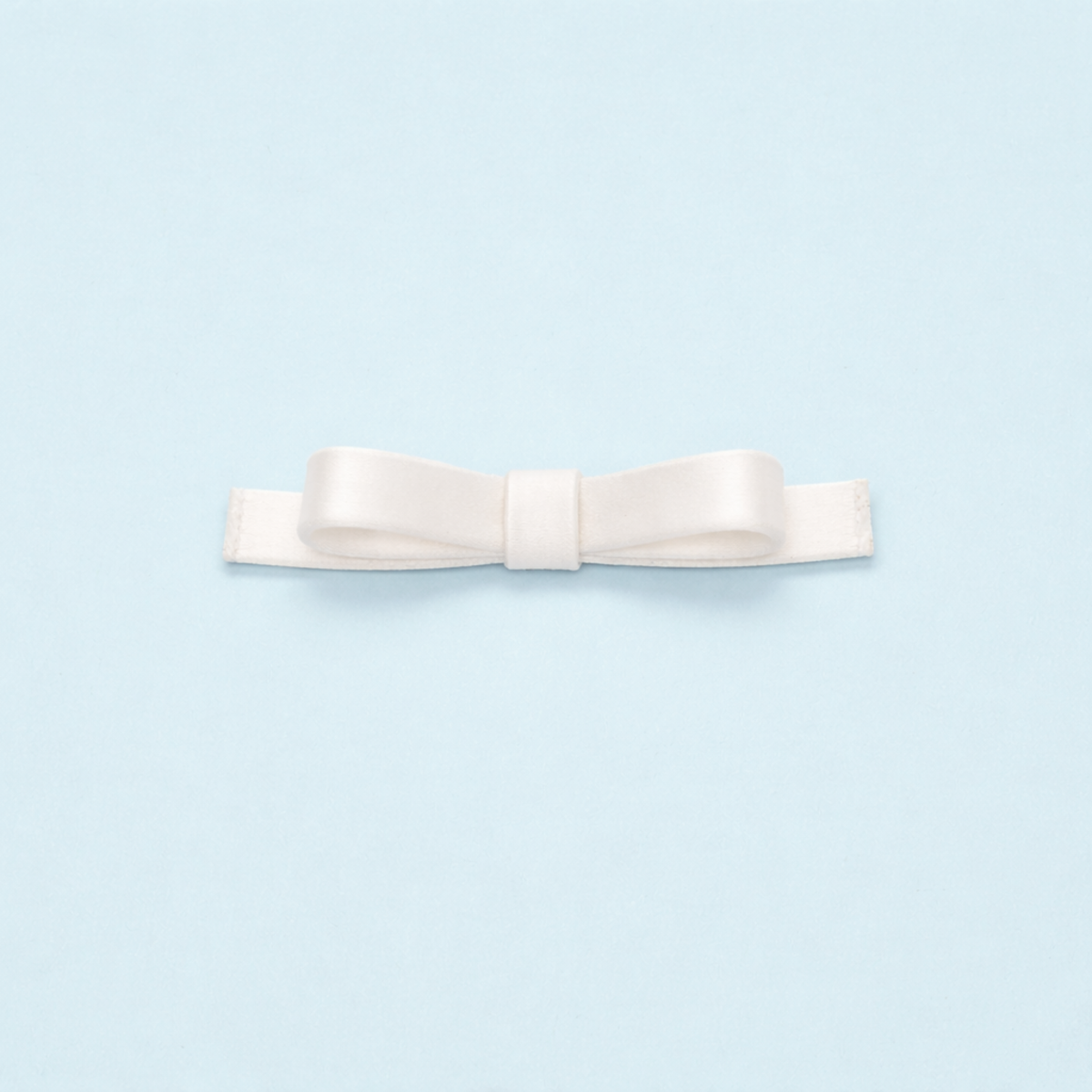 Scarlett Chase white Marais clip-on satin bow shoe accessory | on light blue background