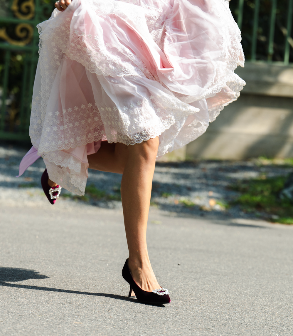 Scarlett Chase Seine 75 Pump in Ruby Velvet with SC toe broach accessory | Lifestyle photo with outdoor background