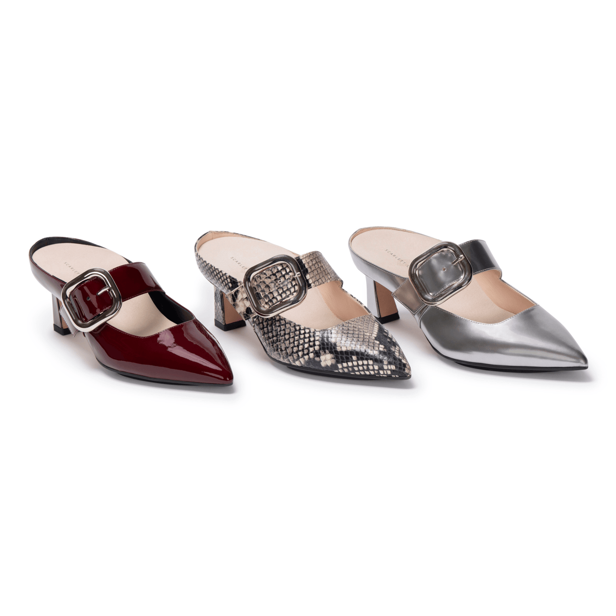 Scarlett Chase bordeaux patent, Gray python, silver lame Italian Leather with a Silver Buckle Audrey 55 pump with an adjustable buckle strap and a block heel | 3/4 of all 3 single shoes lined up on white background