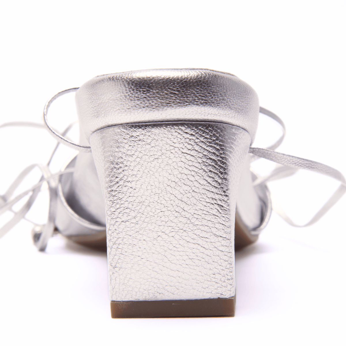 Scarlett Chase champagne metallic nap leather Cali 45 dress sandal with wrap-around ties and a gathered front | detail of back heel from the back on white background
