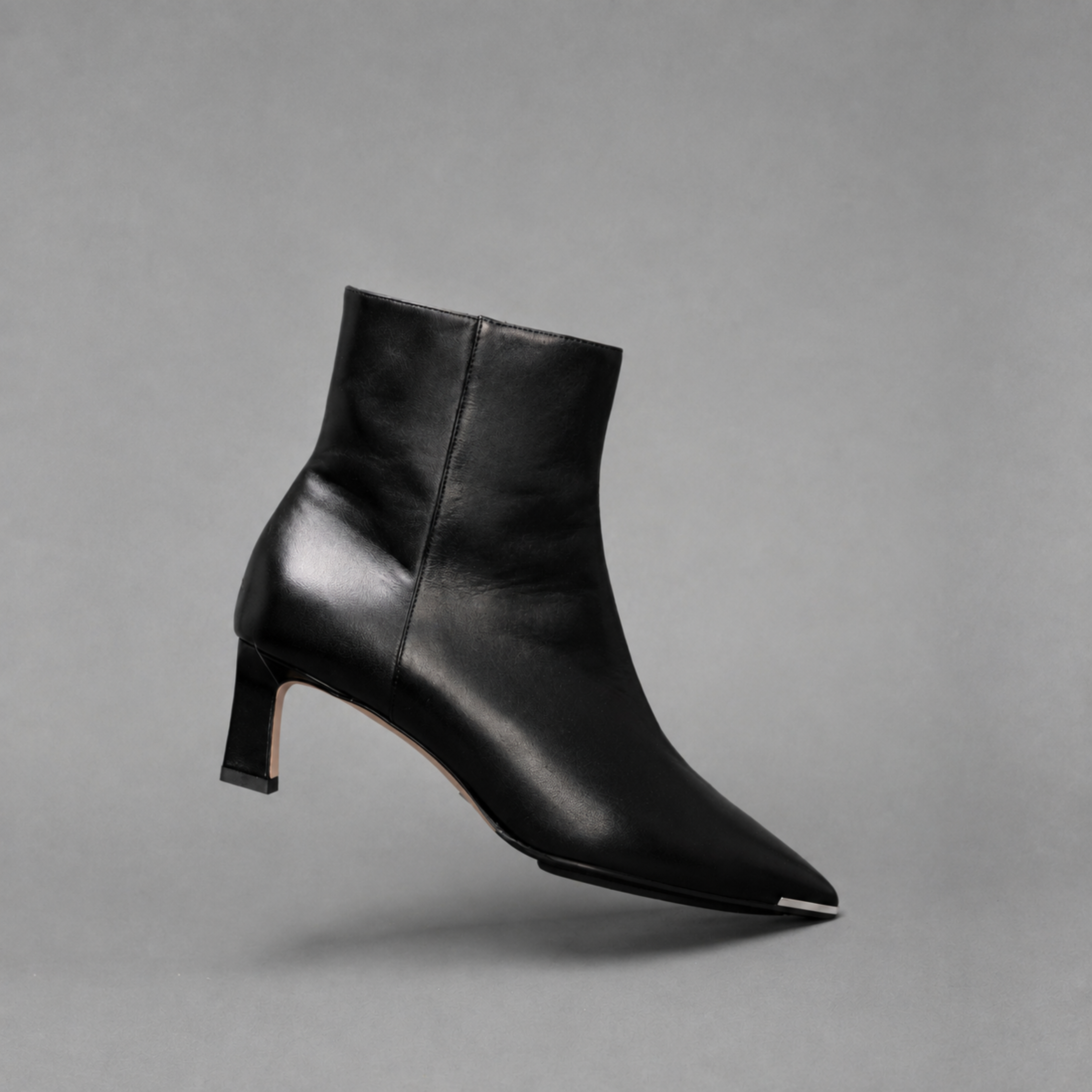 Scarlett Chase ankle zip black napa Aimee 55 bootie with a block heel and gore stretch | Profile on toe on gray background