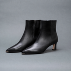 Scarlett Chase ankle zip black napa Aimee 55 bootie with a block heel and gore stretch | 3/4 Profile of pair on gray background