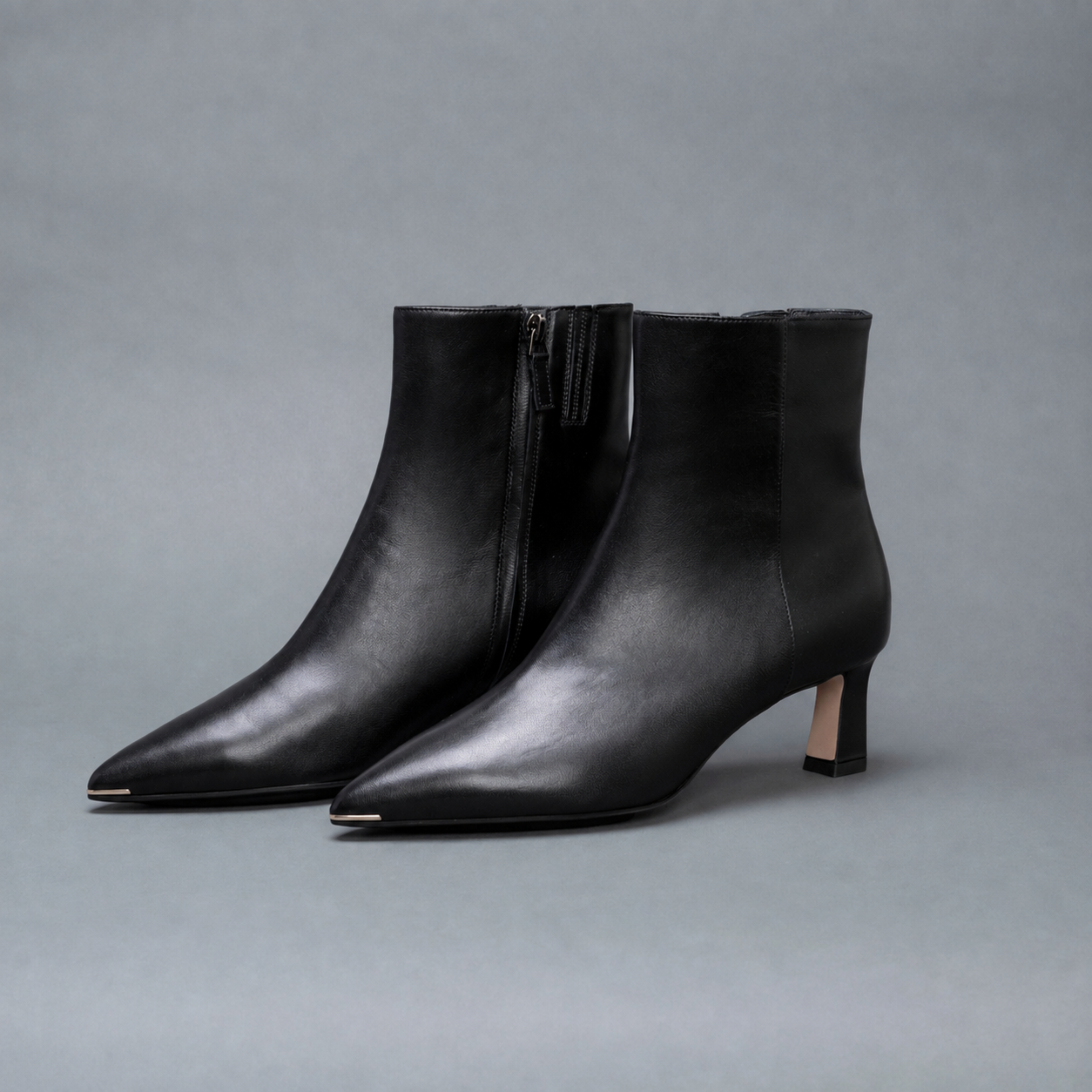 Scarlett Chase ankle zip black napa Aimee 55 bootie with a block heel and gore stretch | 3/4 Profile of pair on gray background