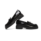 Scarlett Chase Arden Lug Loafer in Black Patent with a lightweight sole and SC accessory | Side view of both shoes on a white background