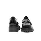 Scarlett Chase Arden Lug Loafer in Black Patent with a lightweight sole and SC accessory | Pic showing front and back angle of shoe on white background