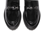 Overhead view of Arden lug loafer showing gunmetal accessory across shoe on white background