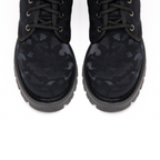 Scarlett Chase Athena Combat Boot with a lightweight sole, functioning hardware, and a hidden zipper | Nylon, Black Camouflage overhead view zoom on toes, black stitching and laces on white background