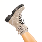 Scarlett Chase Athena Combat Boot with a lightweight sole, functioning hardware, and a hidden zipper | Nylon, Light Camouflage Pattern, person's leg extended in air showing side view of boot on white background