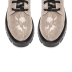 Scarlett Chase Athena Combat Boot with a lightweight sole, functioning hardware, and a hidden zipper | Nylon, Light Camouflage Pattern, zoom shot of toe, stitching and black laces