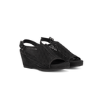 Scarlett Chase Chelsea Wedge Sandal with a perforated leather upper and adjustable back strap | 3/4 view of black suede sandals on white background