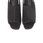 Scarlett Chase Chelsea Wedge Sandal with a perforated leather upper and adjustable back strap | overhead view of black pair of sandals on white background