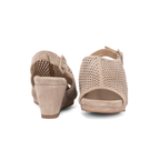 Scarlett Chase Chelsea Wedge Sandal with a perforated leather upper and adjustable back strap | one rear-facing sandal and one front-facing sand suede sandal on white background