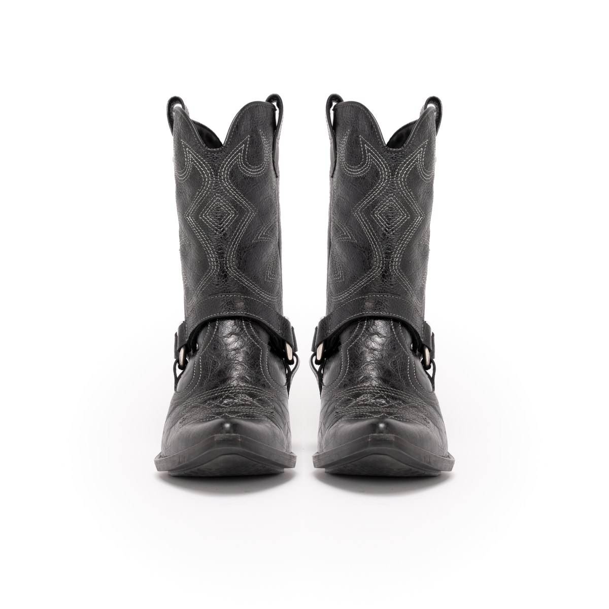 Scarlett Chase black leather interchangeable mid-calf Fiona cowboy boot gaiter with decorative stitching and clip-on straps and Fiona cowboy bootie with decorative stitching and a side zipper | | Pair of mid-calf gaiters attached to booties facing forward on white background