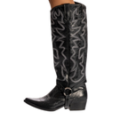 Scarlett Chase black leather Fiona cowboy bootie with decorative stitching and a side zipper and interchangeable knee-high gaiter with decorative sticking and clip-on straps| profile of knee-high gaiter and bootie attached and on leg on white background