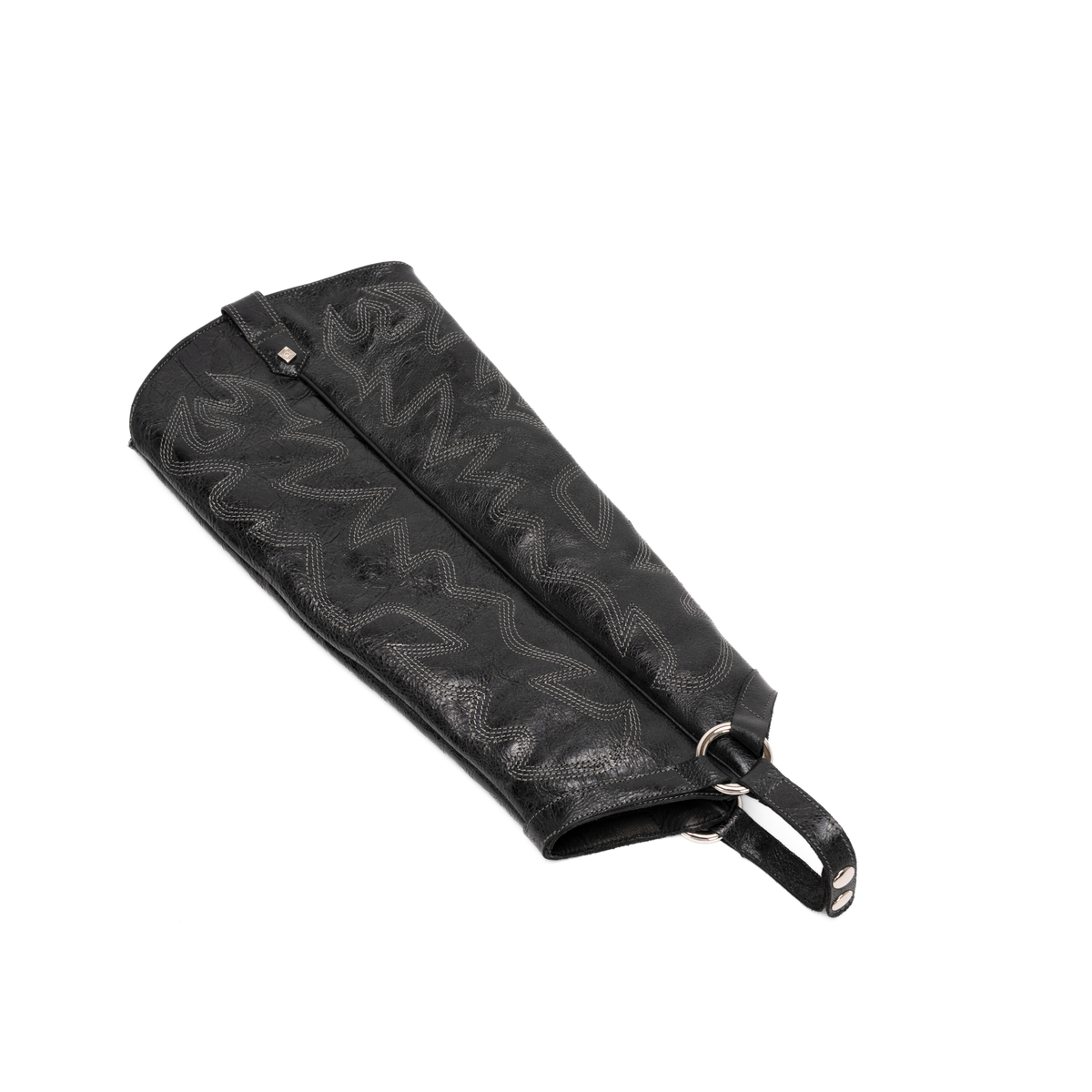 Scarlett Chase black leather interchangeable knee-high gaiter with decorative sticking and clip-on straps| Gaiter laying flat on white background