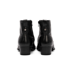 Scarlett Chase Flynn black leather riding boot with a side zipper | Detail view of back of pair on white background 