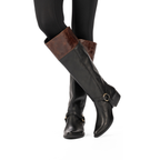 Scarlett Chase Flynn wide black leather riding boot with a side zipper and black / tan leather Flynn interchangeable knee-high riding boot gaiter with classic upper band and clip-on straps | Pair on model with legs crossed and 3/4 view of one boot/knee-high wide gaiter and front view of other boot and knee-high wide width gaiter on white background