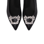 Scarlett Chase black metallic Grayson 55 Metallic Dress Pump with a rounded upper, sculpted heel, and a rhinestone toe accessory | Detail of toe accessory on white background