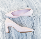 Scarlett Chase Scarlett 75 Pump Light Pink Patent with a V-cut upper and block heel | Profile on one shoe and overhead view of the other on a marble white background