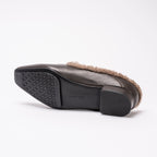 Scarlett Chase Weston Brown Leather and Camel Shearling Mule with an SC accessory | Outsole on a white background