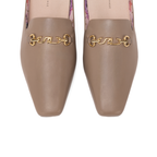 Scarlett Chase Weston Mule in Taupe Napa with floral lining and an SC gold accessory | Overhead 3/4 view on white background