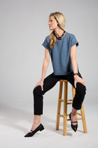 Scarlett Chase noir mesh upper with italian patent leather Brie Ballet with a 3/4 elastic contrast Mary Jane strap, leather contrast trim, and contrast toe cap | One side view with heel in air, other shoe top down view heel resting on stool rung model sitting on stool with white background