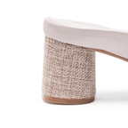 Scarlett Chase Chloe panna cotta napa leather 45 raffia block heel sandal with a mesh-lined quilted upper and SC accessory | Profile of heel detail on white background