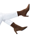 Scarlett Chase ankle stretch chocolate suede Maya 55 bootie with a block heel | On model white jeans legs staggered in air on white background
