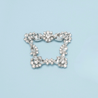Scarlett Chase Paris rhinestone clip-on brooch shoe accessory | on light blue background