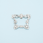 Scarlett Chase Paris rhinestone clip-on brooch shoe accessory | on light blue background
