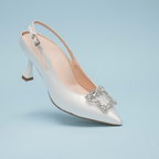 Scarlett Chase White Rory 75 Slingback with a stable, sculpted heel and an adjustable backstrap buckle | Profile on light blue background