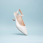 Scarlett Chase Rose 55 Pump with a rounded upper, sculpted heel, and adjustable back strap with pearl buckle | Profile on light blue background