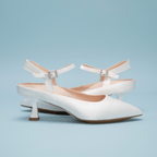Scarlett Chase Rose 55 Pump with a rounded upper, sculpted heel, and adjustable back strap with pearl buckle | profile on light blue background
