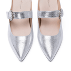 Scarlett Chase silver metallic Vivian 75 Backless Pump with a curved heel and crystal rhinestone buckle | Overhead 3/4 view on white background