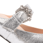 Scarlett Chase silver metallic Vivian 75 Backless Pump with a curved heel and crystal rhinestone buckle | Zoomed 1/2 view on white background