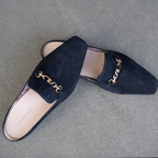 Scarlett Chase Weston Mule in Navy Suede with floral lining and an SC gold accessory | Overhead view on granite floor background