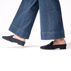 Scarlett Chase Weston Mule in Navy Suede and an SC gold accessory | On feet on white background