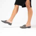 Scarlett Chase Weston Mule in Black Grey Houndstooth Textile and an SC gunmetal accessory | On feet on white background
